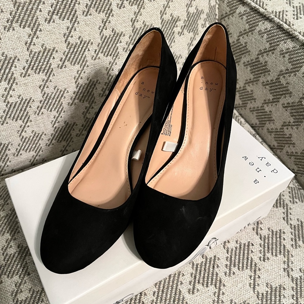 Black suede wedge pumps